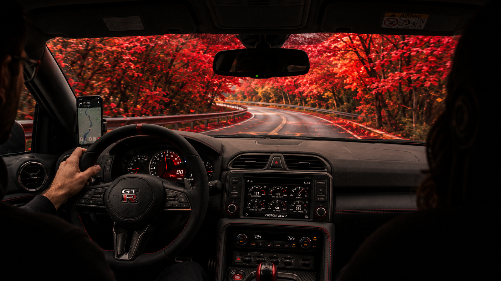 In-car view on a scenic road during driver training.